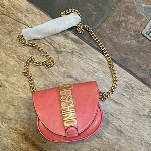 Moschino pink cross body with gold.
